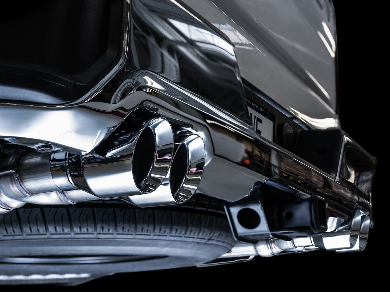 AWE Tuning 19-22 4th Gen GM 1500 5.3L 0FG Catback Split Rear Exit (w/ Bumper Cutouts) - Quad Chrome Tips 3015-42201
