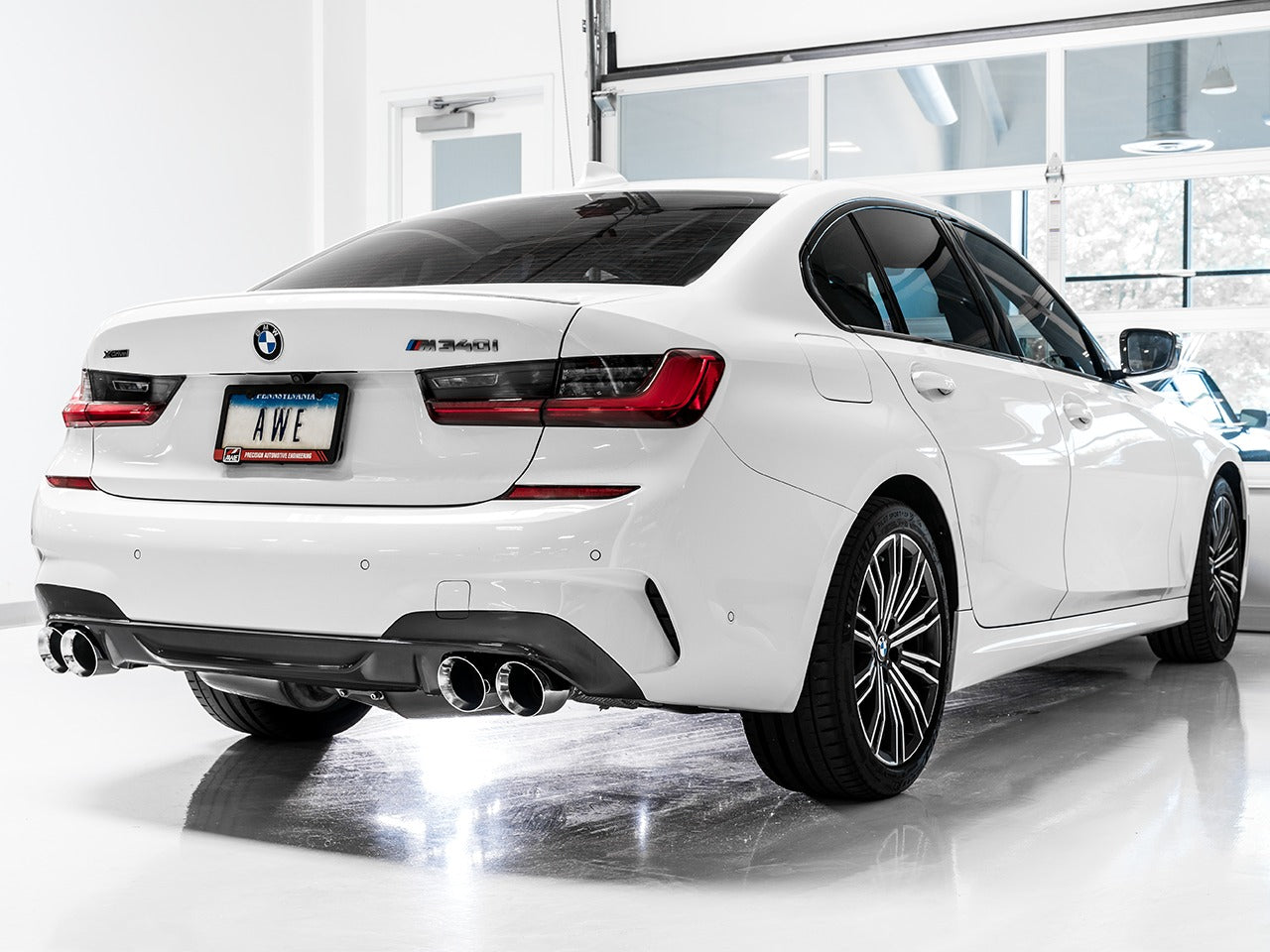 AWE Tuning 19-22 BMW M340i (G20) Resonated Touring Edition Exhaust - Quad Chrome Silver Tips 3015-42150